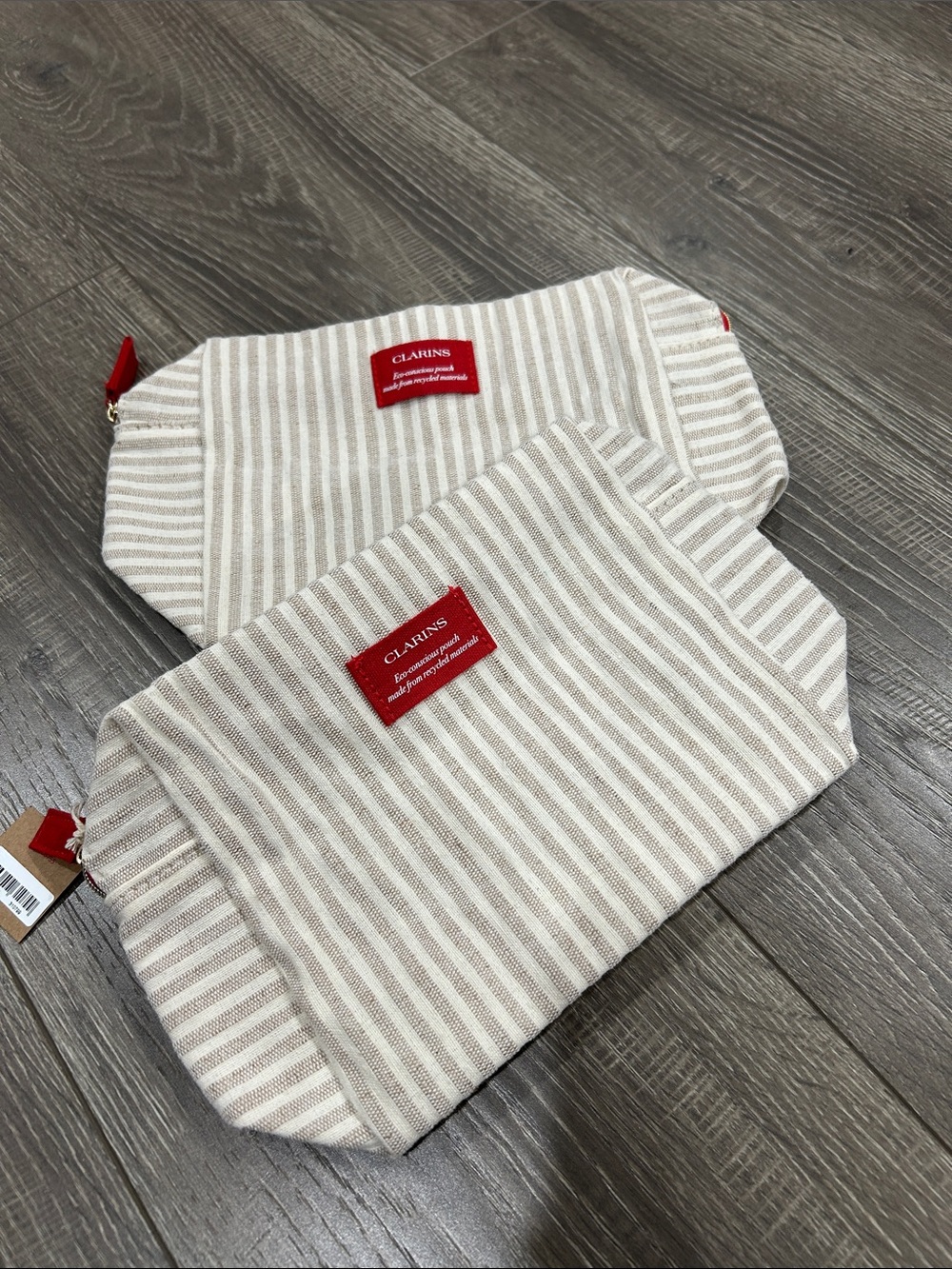 Clarins Beige & White Striped Cosmetic Pouch Set with Red Logo